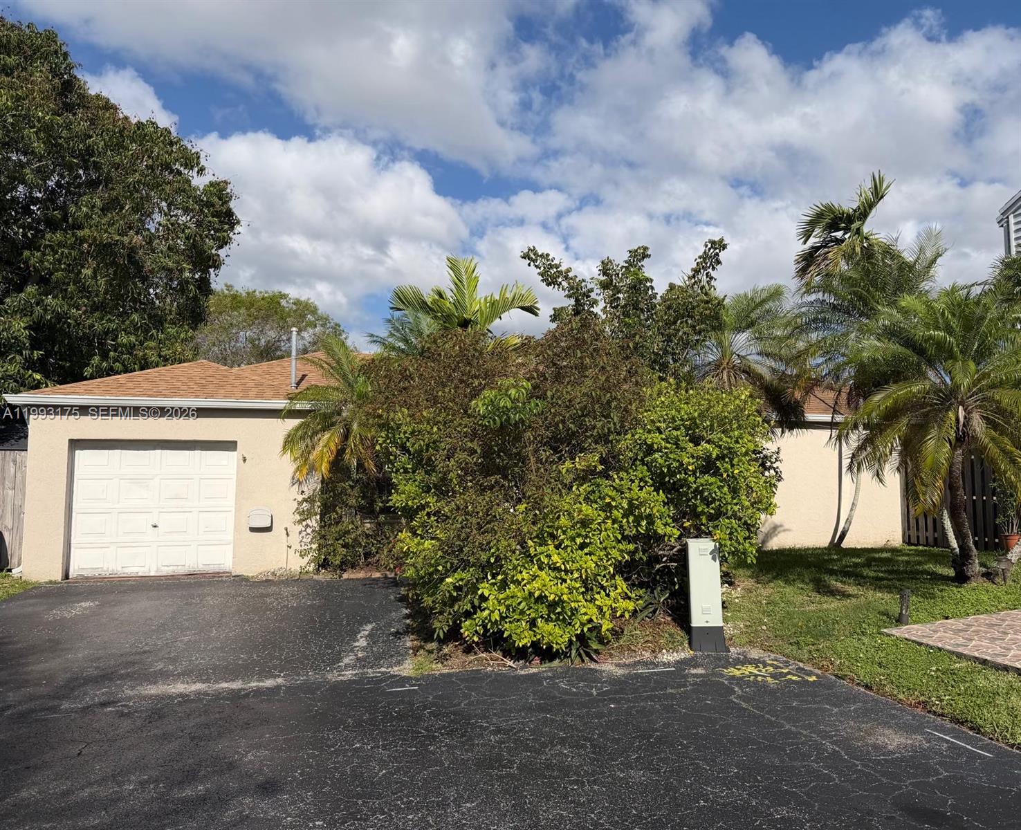 12695 Southwest 144th Terrace Miami, FL 33186 - Photo 24 of 43 a front view of a house with garden