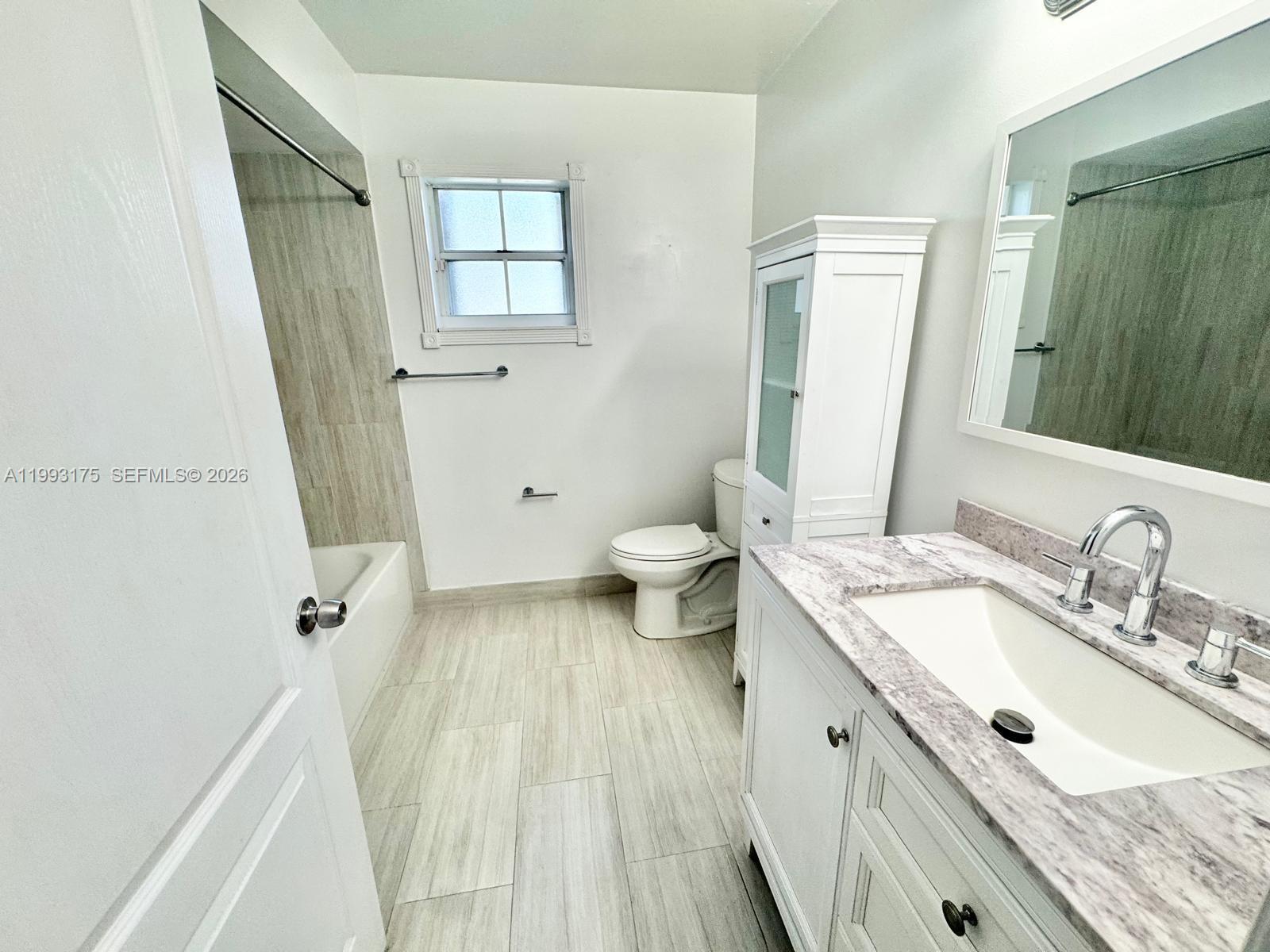 12695 Southwest 144th Terrace Miami, FL 33186 - Photo 27 of 43 a bathroom with a granite countertop sink toilet and shower