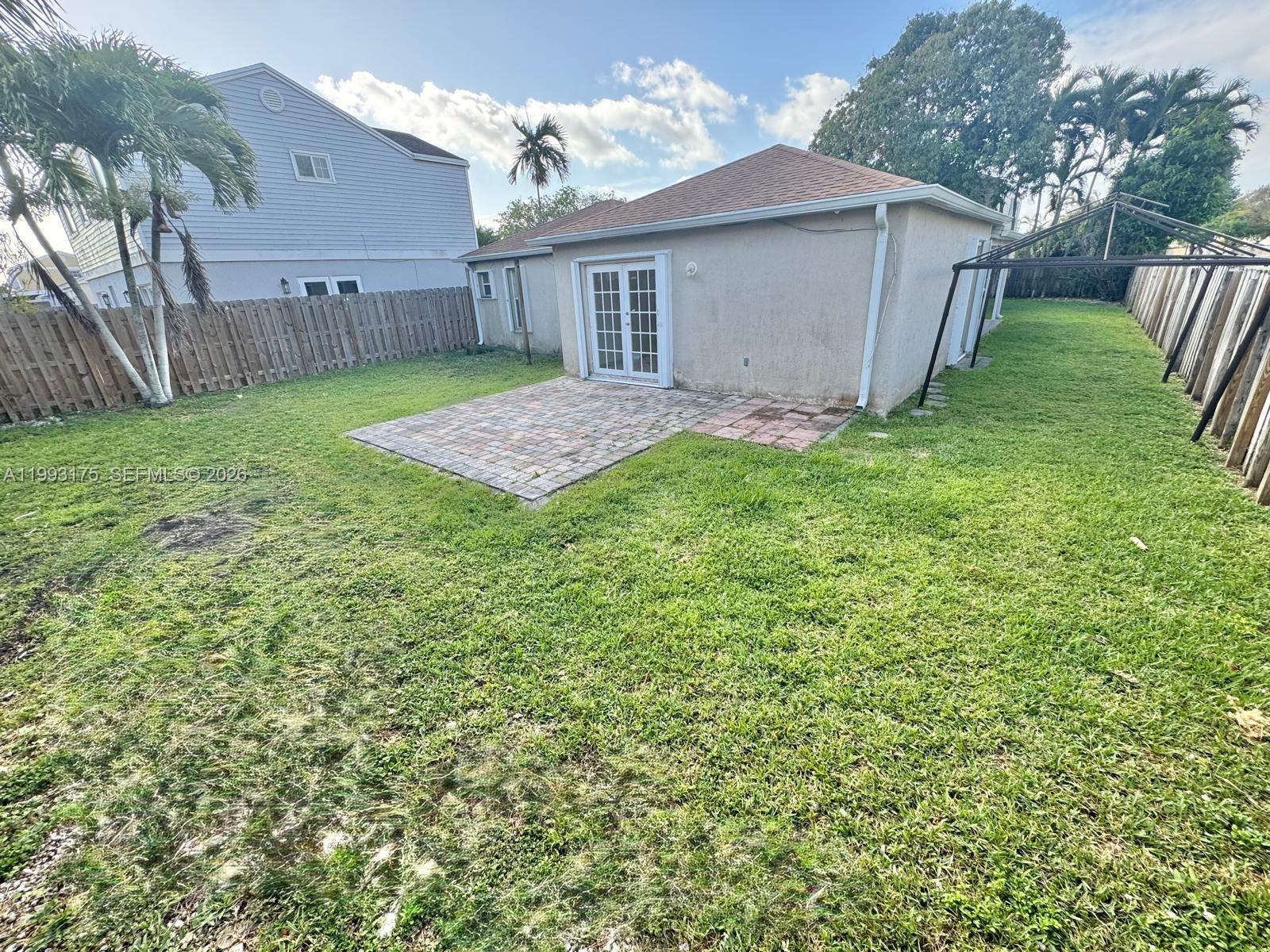 12695 Southwest 144th Terrace Miami, FL 33186 - Photo 31 of 43 a view of backyard of house with green space
