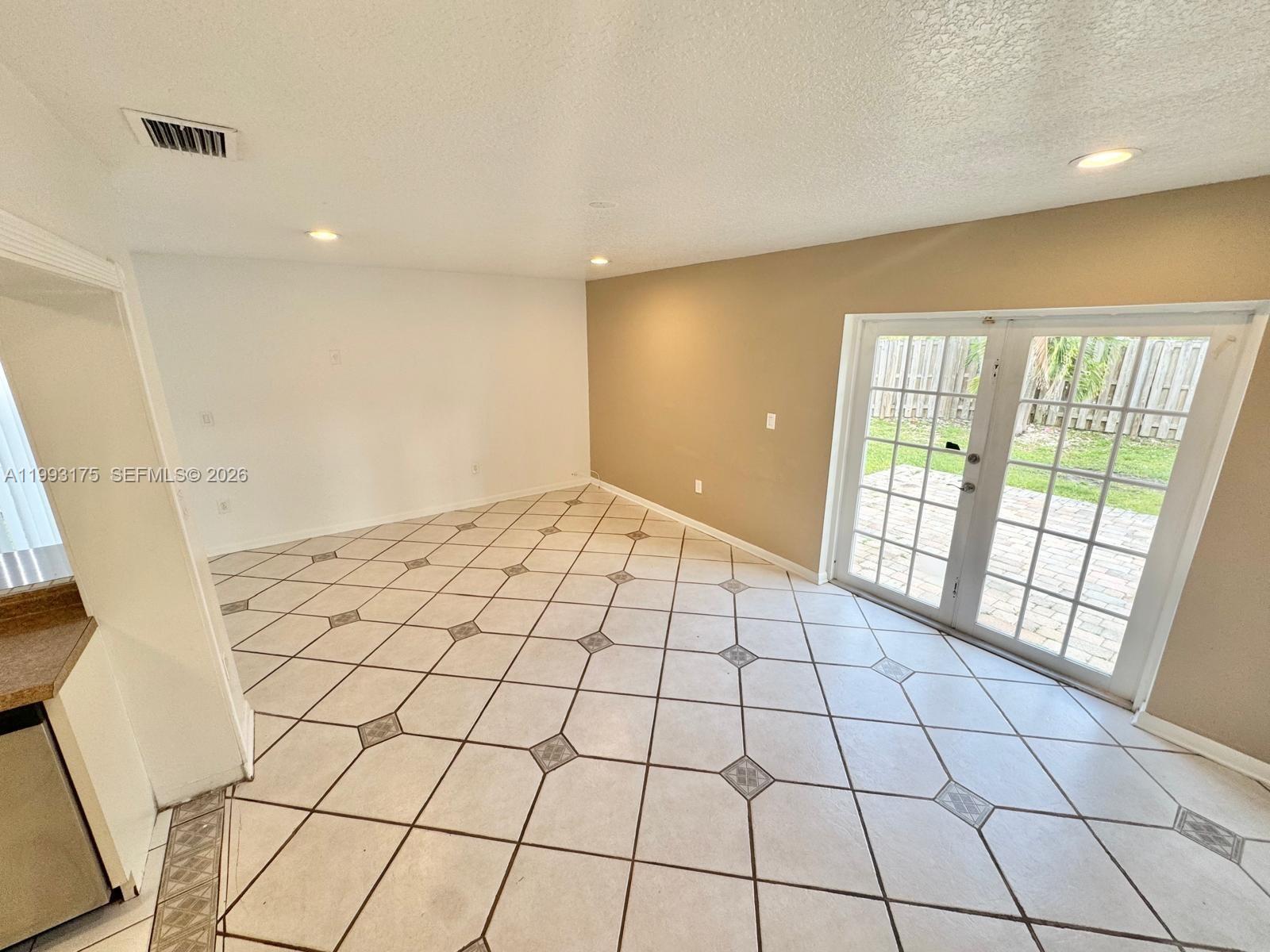 12695 Southwest 144th Terrace Miami, FL 33186 - Photo 34 of 43 a view of an empty room and window in a room