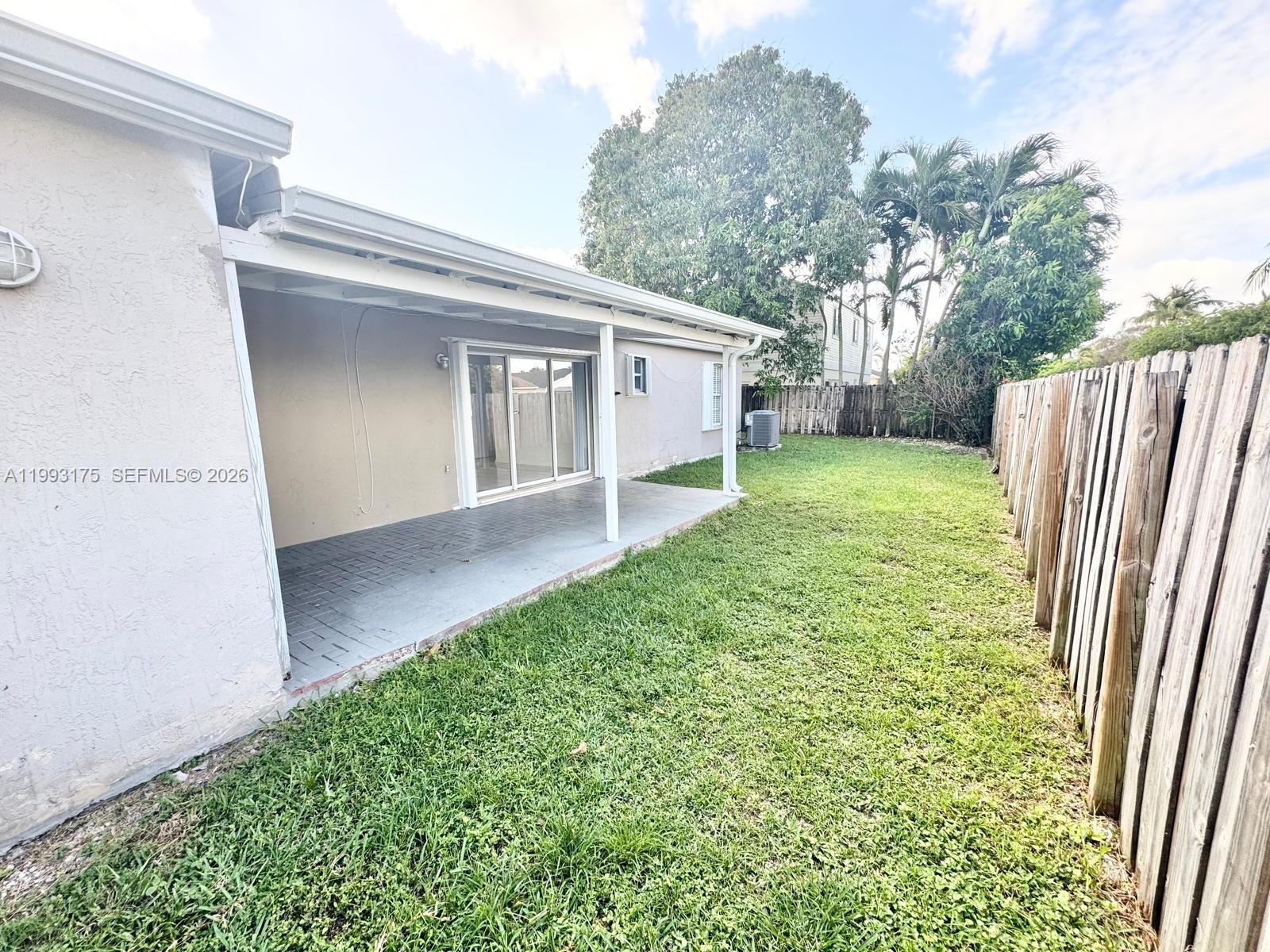 12695 Southwest 144th Terrace Miami, FL 33186 - Photo 36 of 43 a view of a back yard of the house
