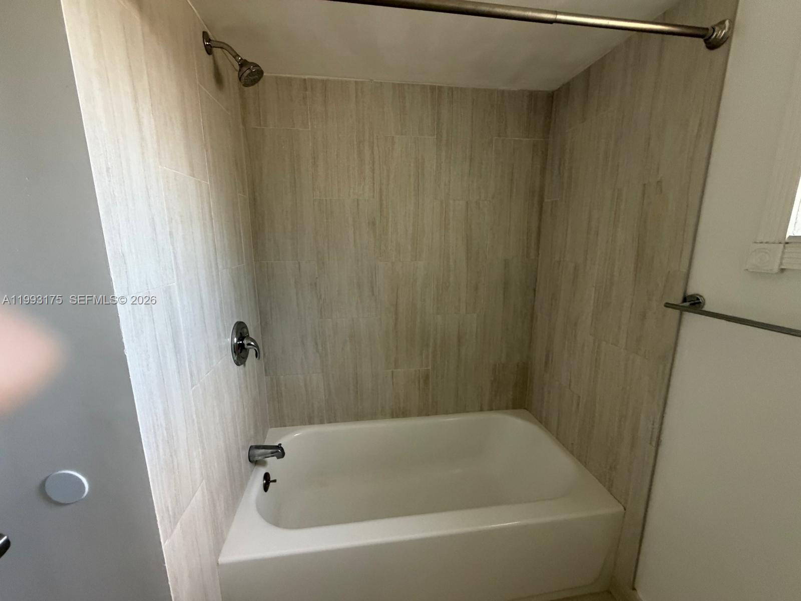 12695 Southwest 144th Terrace Miami, FL 33186 - Photo 7 of 43 a bathroom with a bathtub