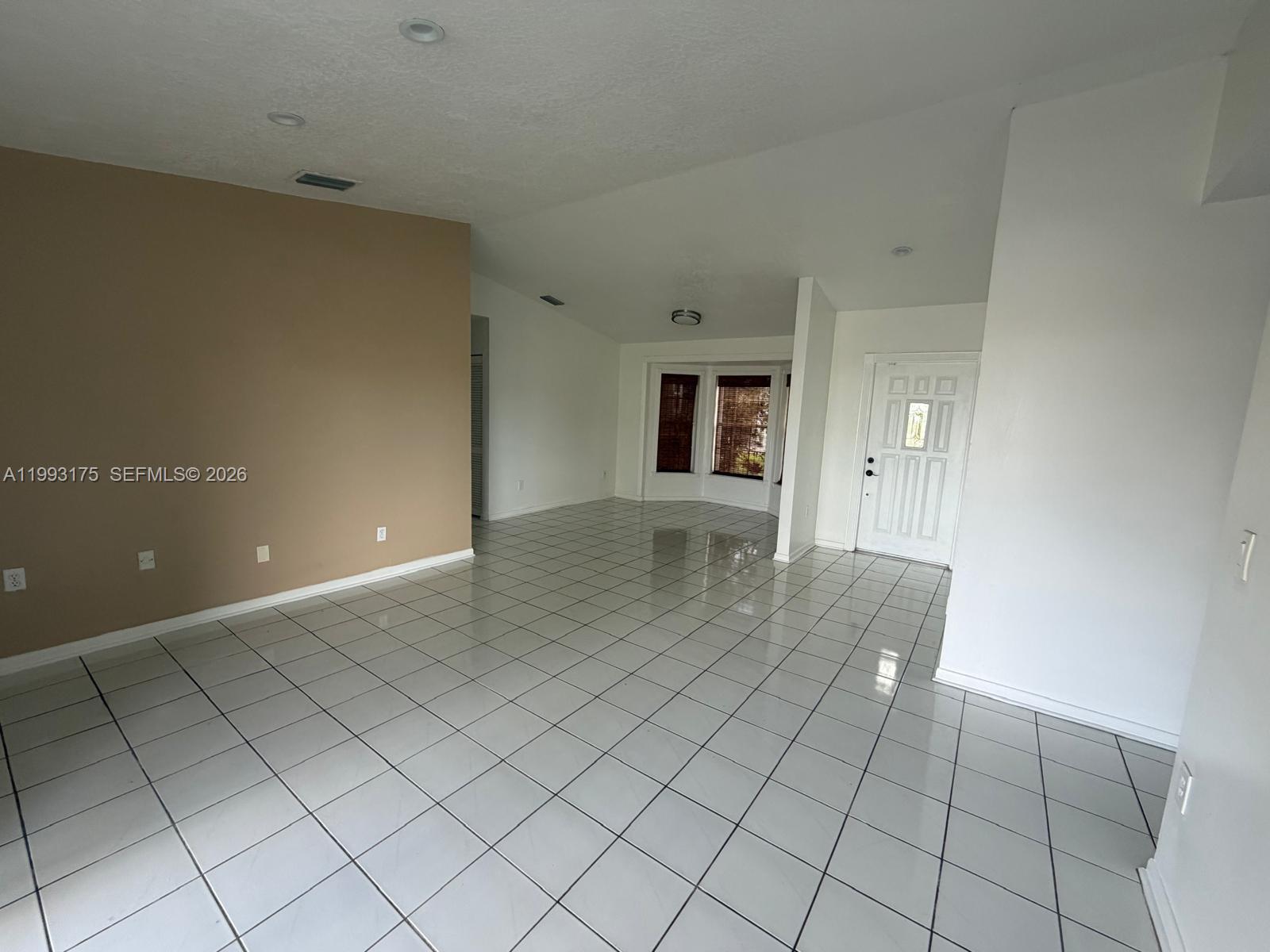 12695 Southwest 144th Terrace Miami, FL 33186 - Photo 10 of 43 an empty room with natural light