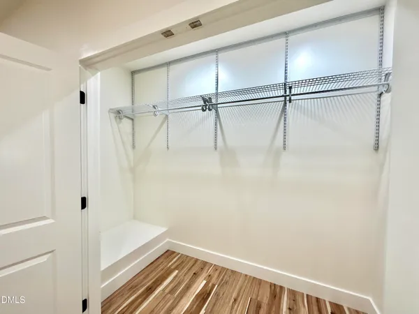 a bathroom with a shower and a glass door