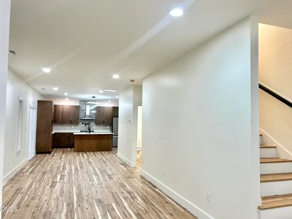 a view of kitchen and wooden floor