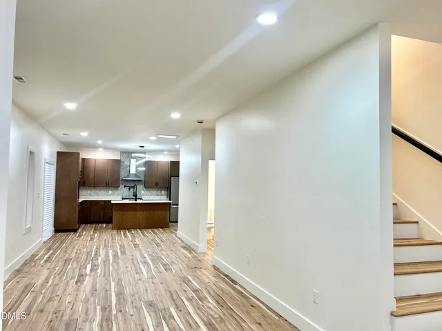 a view of kitchen and wooden floor
