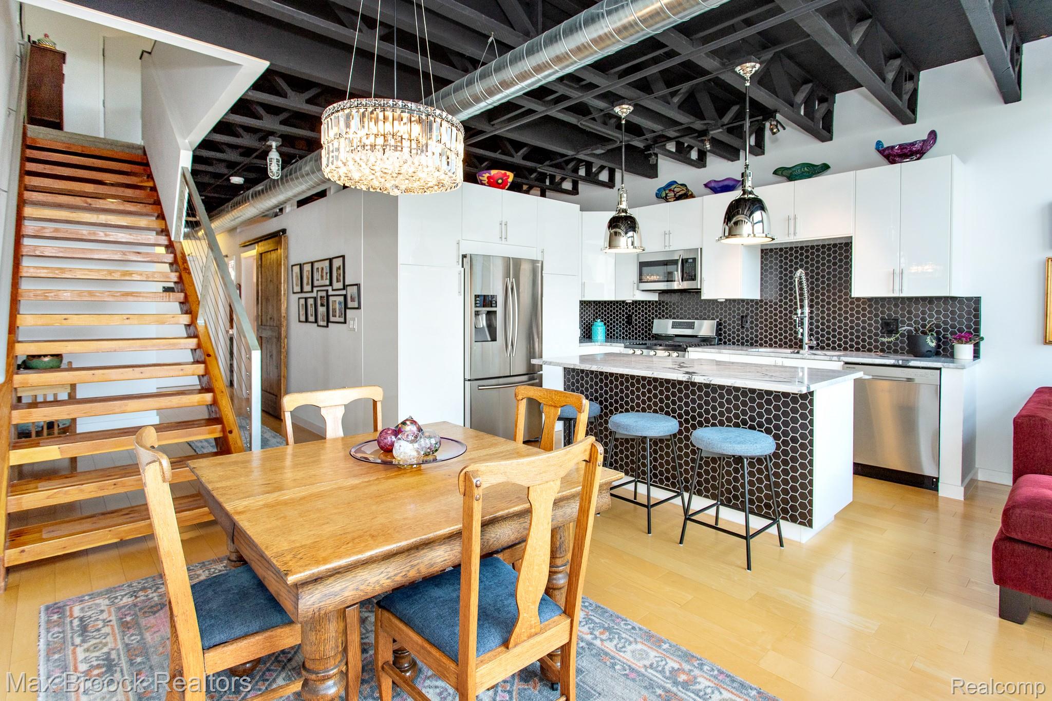 211 East 9 Mile Road, Unit 307 Ferndale, MI 48220 - Photo 18 of 60 Dining area featuring light wood finished floors and suspended lighting