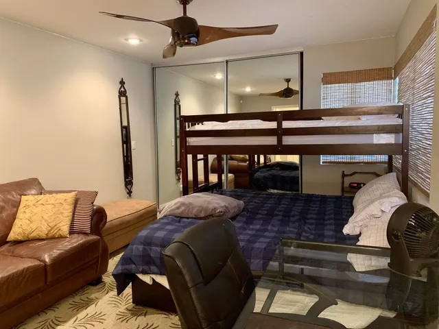 a bathroom with double sink and a mirror