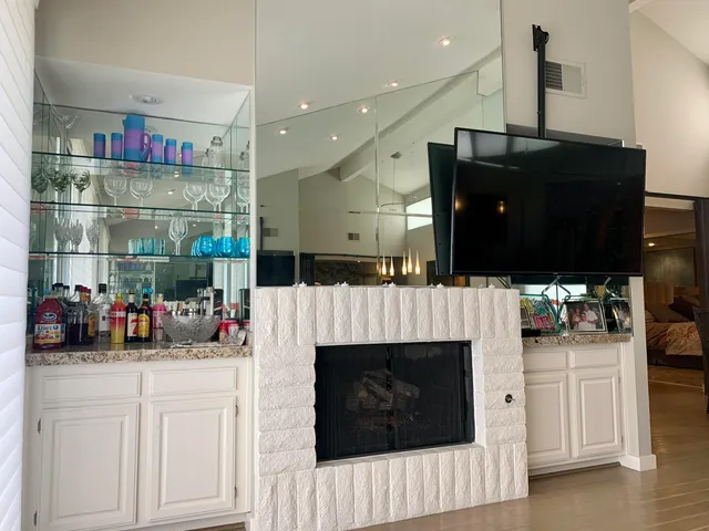 a view of a dining room with furniture and chandelier