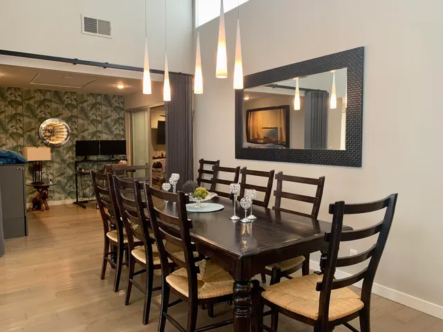 a kitchen with stainless steel appliances granite countertop a refrigerator sink and stove