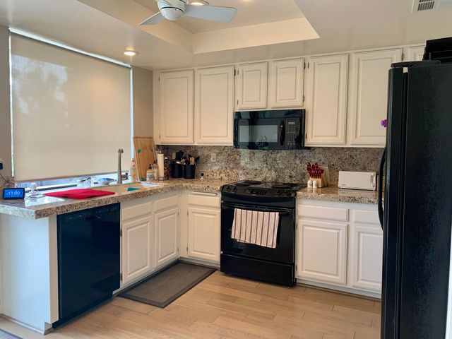 a bedroom with a bed and a mirror