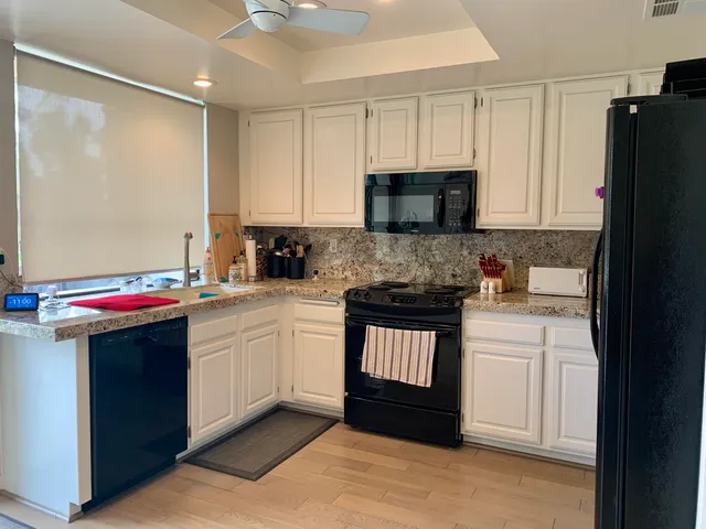 a bedroom with a bed and a mirror