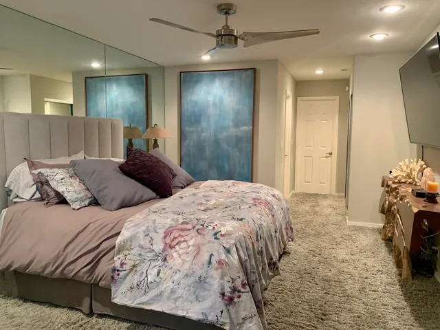 a bathroom with a double vanity sink toilet and shower