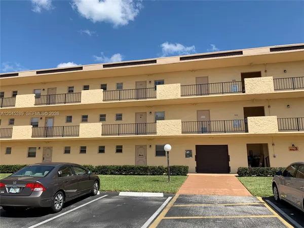 a large parking space in front of a building