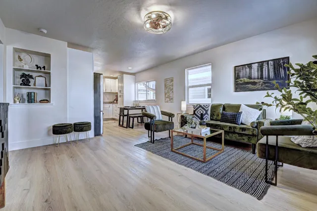 a bedroom with a bed and a potted plant