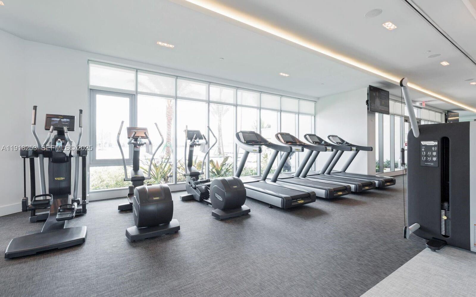17111 Biscayne Boulevard, Unit 2103 North Miami Beach, FL 33160 - Photo 22 of 33 a view of a room with gym equipment