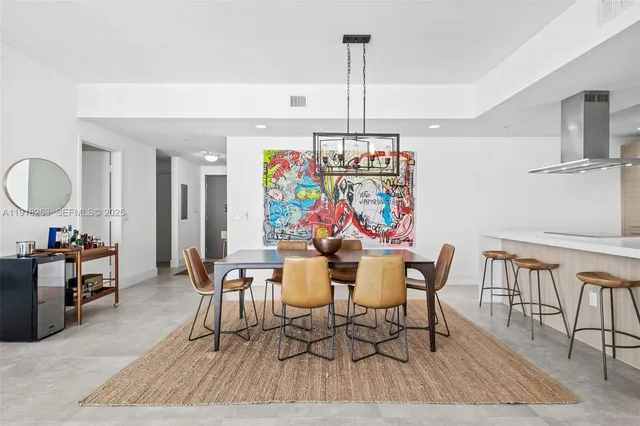 a kitchen with sink cabinets and living room view