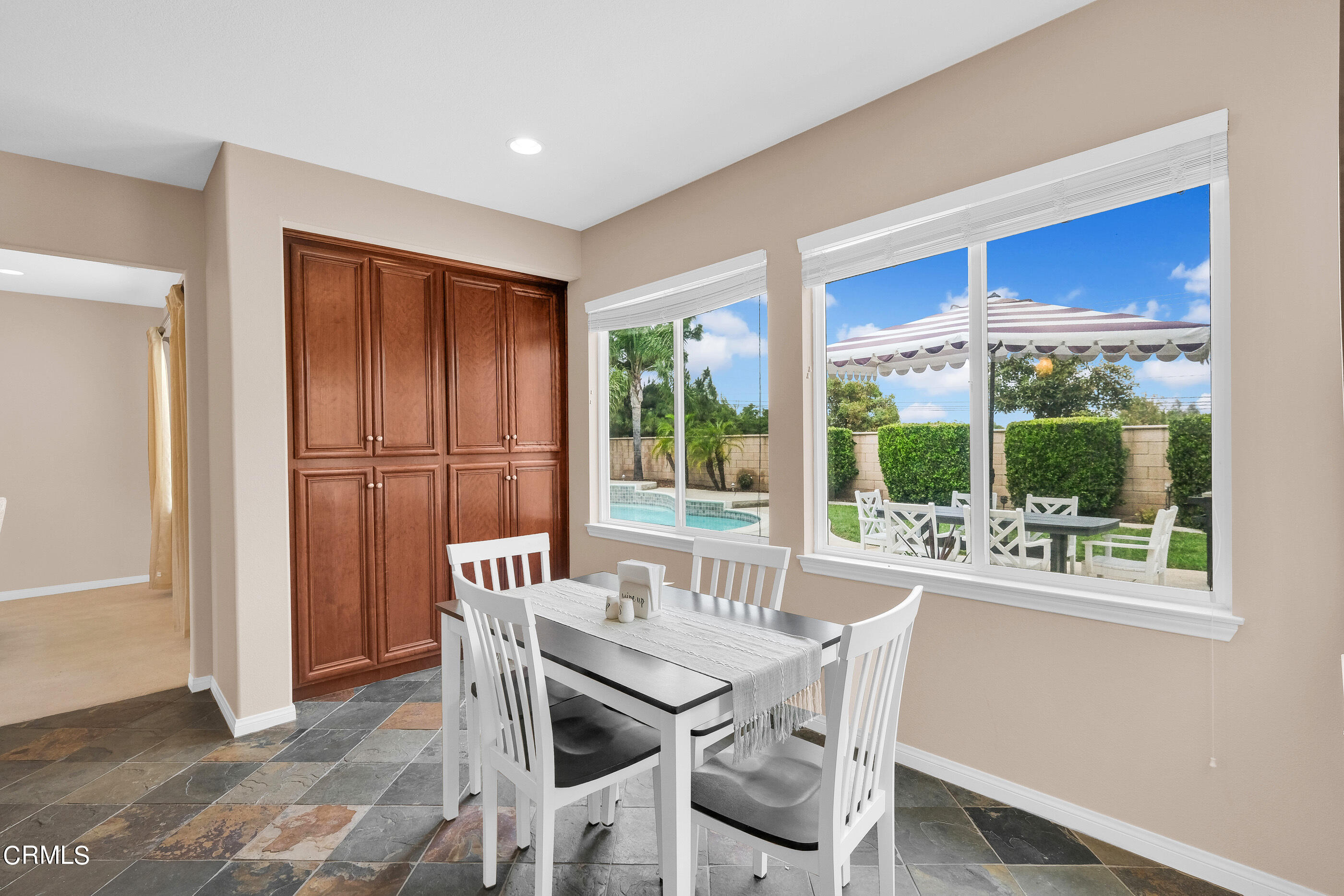 8317 Carriage Court Riverside, CA 92508 - Photo 17 of 37 a dining room with furniture and a window
