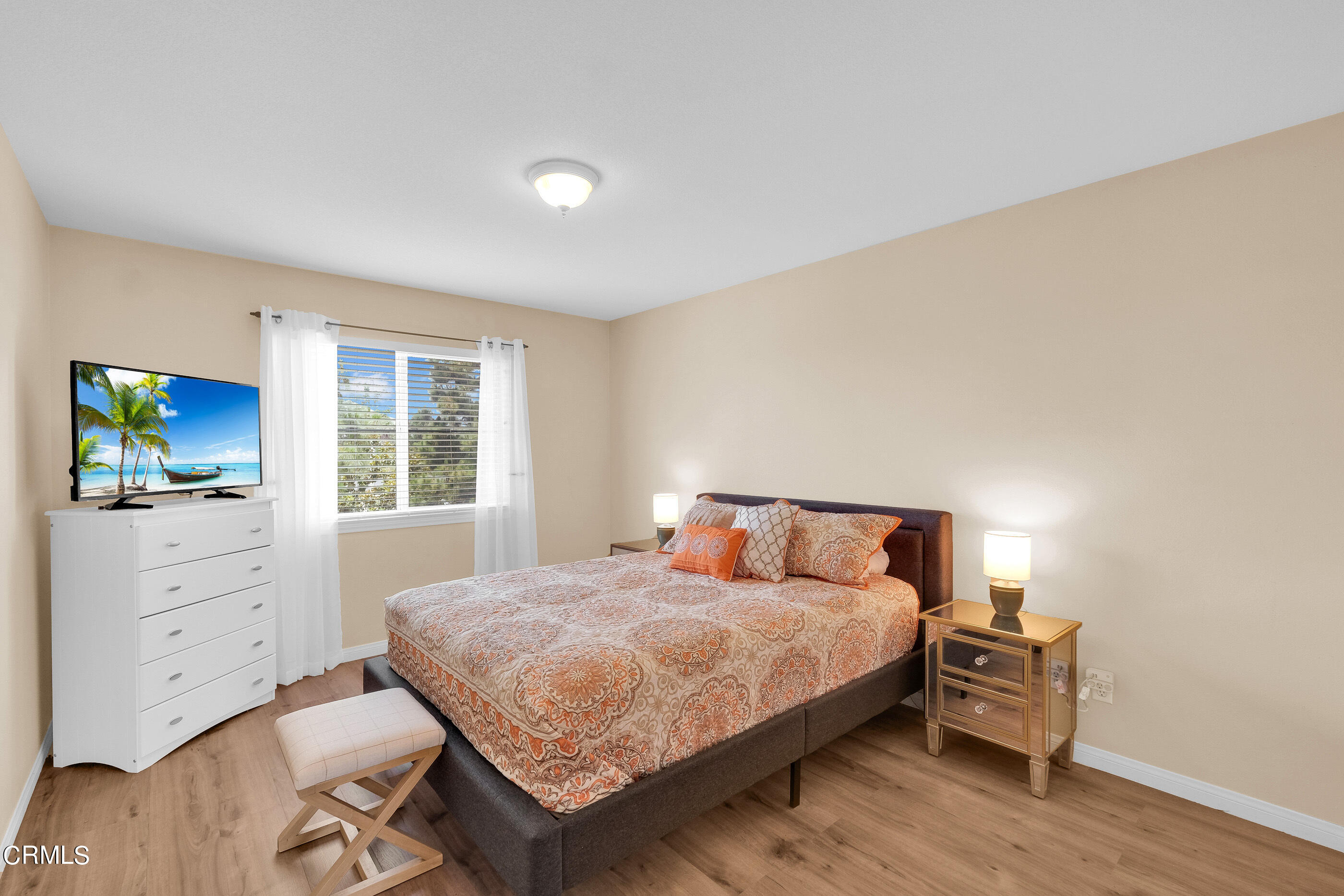 8317 Carriage Court Riverside, CA 92508 - Photo 23 of 37 a bedroom with a bed and a flat screen tv