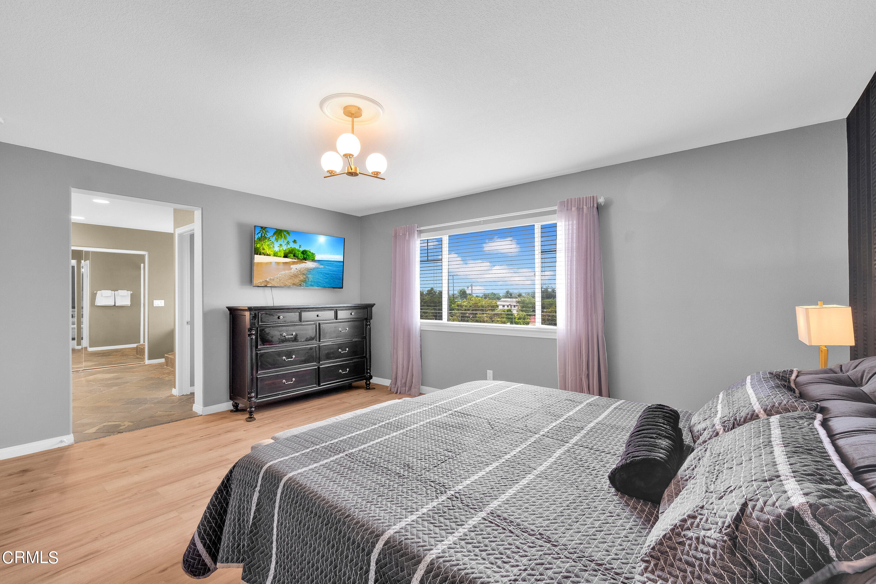 8317 Carriage Court Riverside, CA 92508 - Photo 26 of 37 a bedroom with a bed and a fireplace