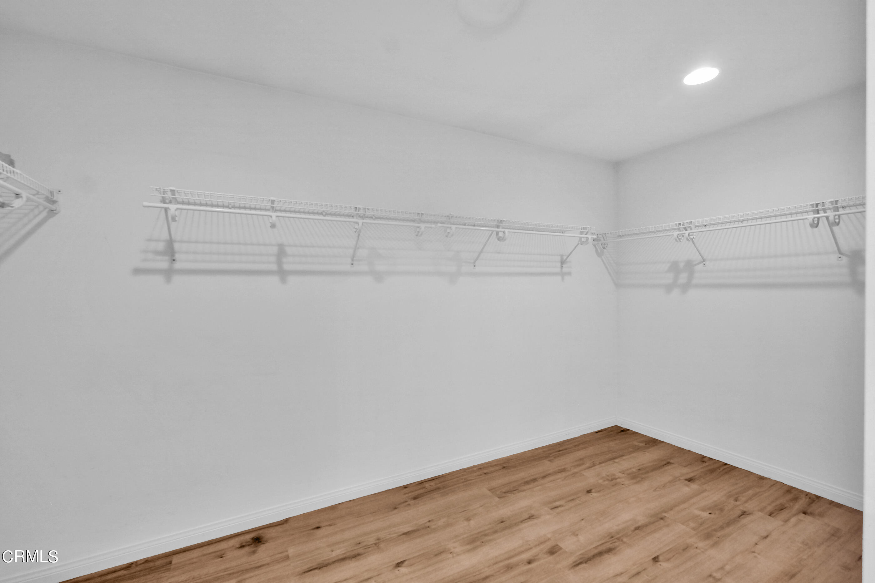 8317 Carriage Court Riverside, CA 92508 - Photo 29 of 37 a view of a room with wooden floor and fan