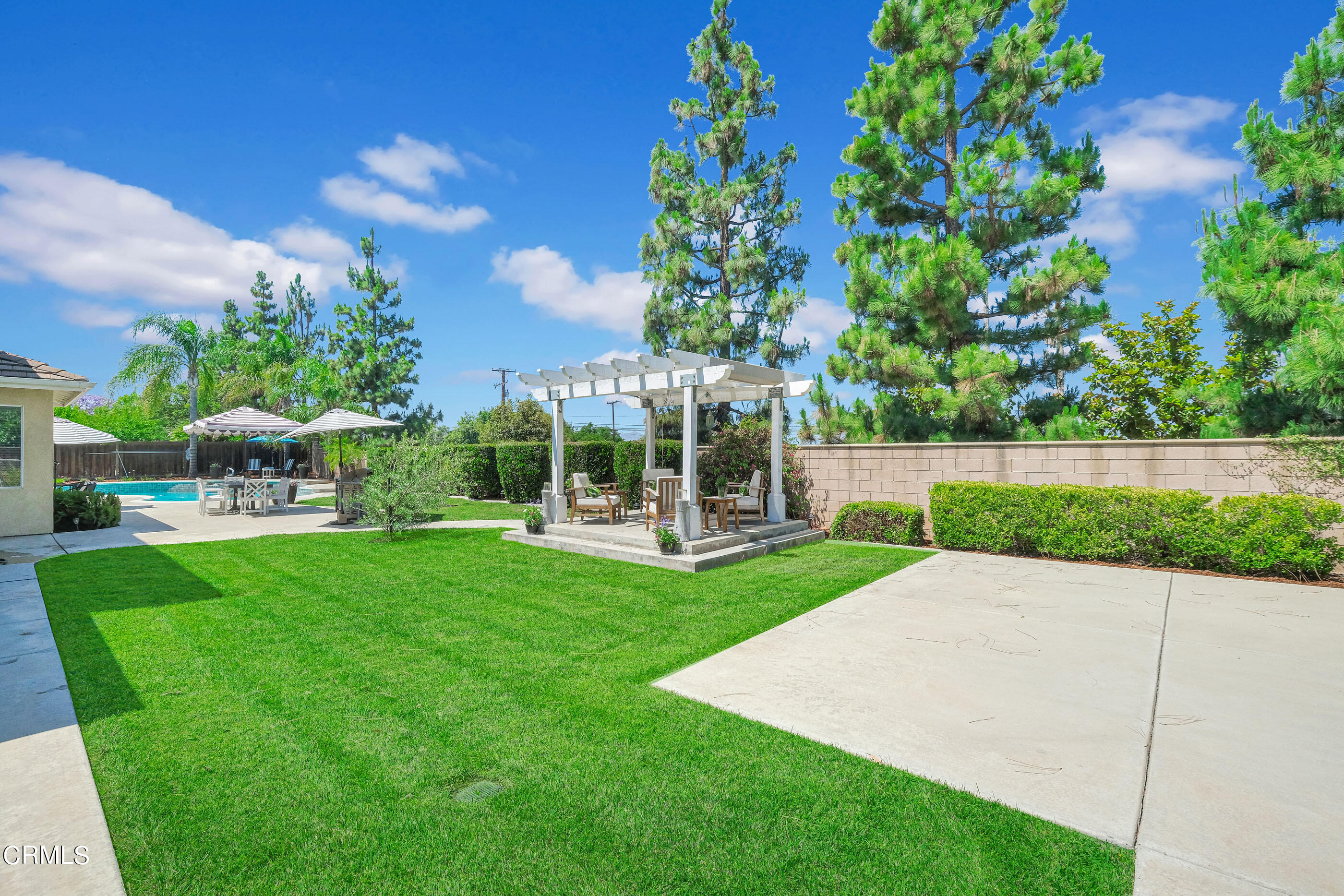 8317 Carriage Court Riverside, CA 92508 - Photo 32 of 37 a view of yard with swimming pool and green space
