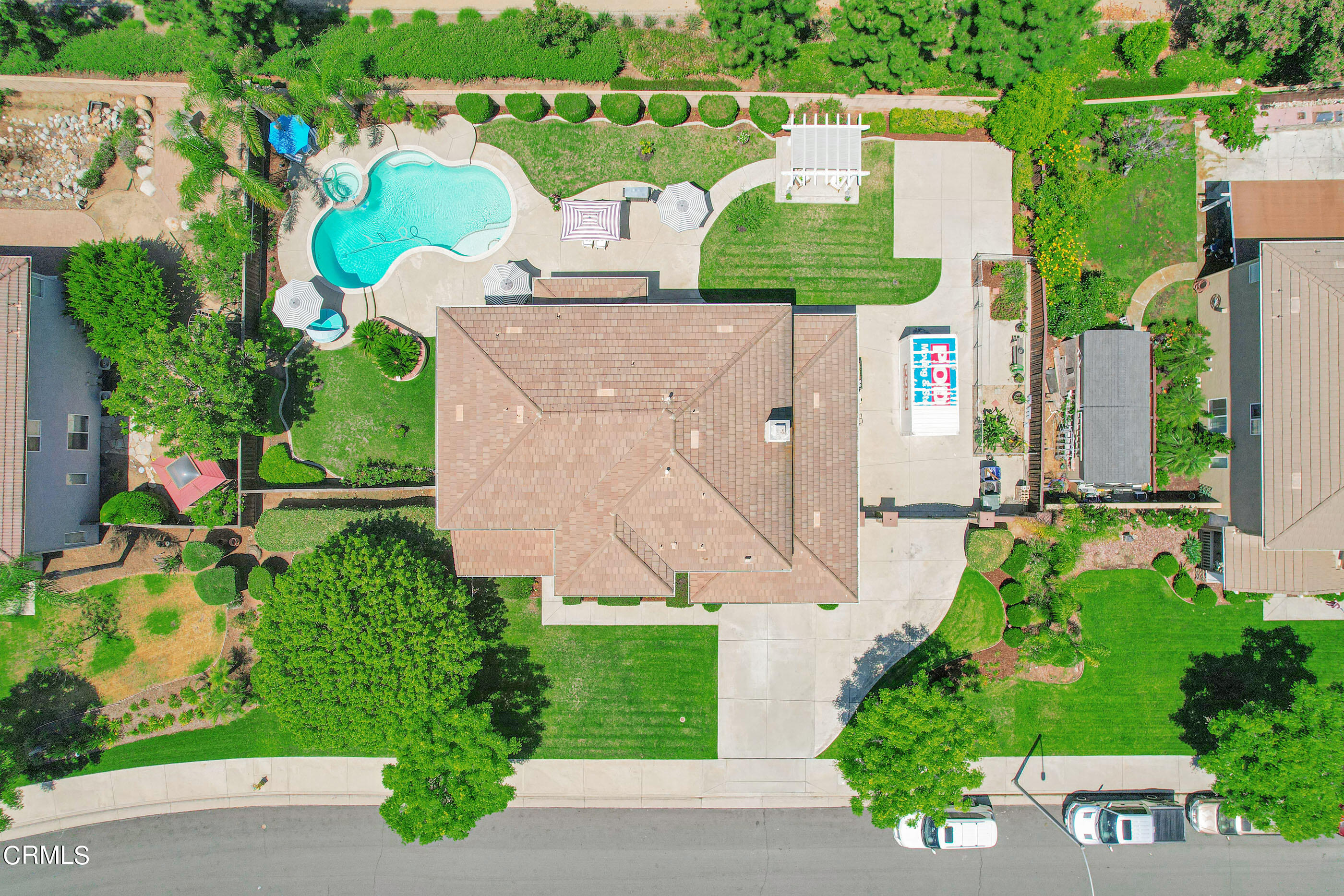 8317 Carriage Court Riverside, CA 92508 - Photo 35 of 37 an aerial view of a house with a garden and a lake view