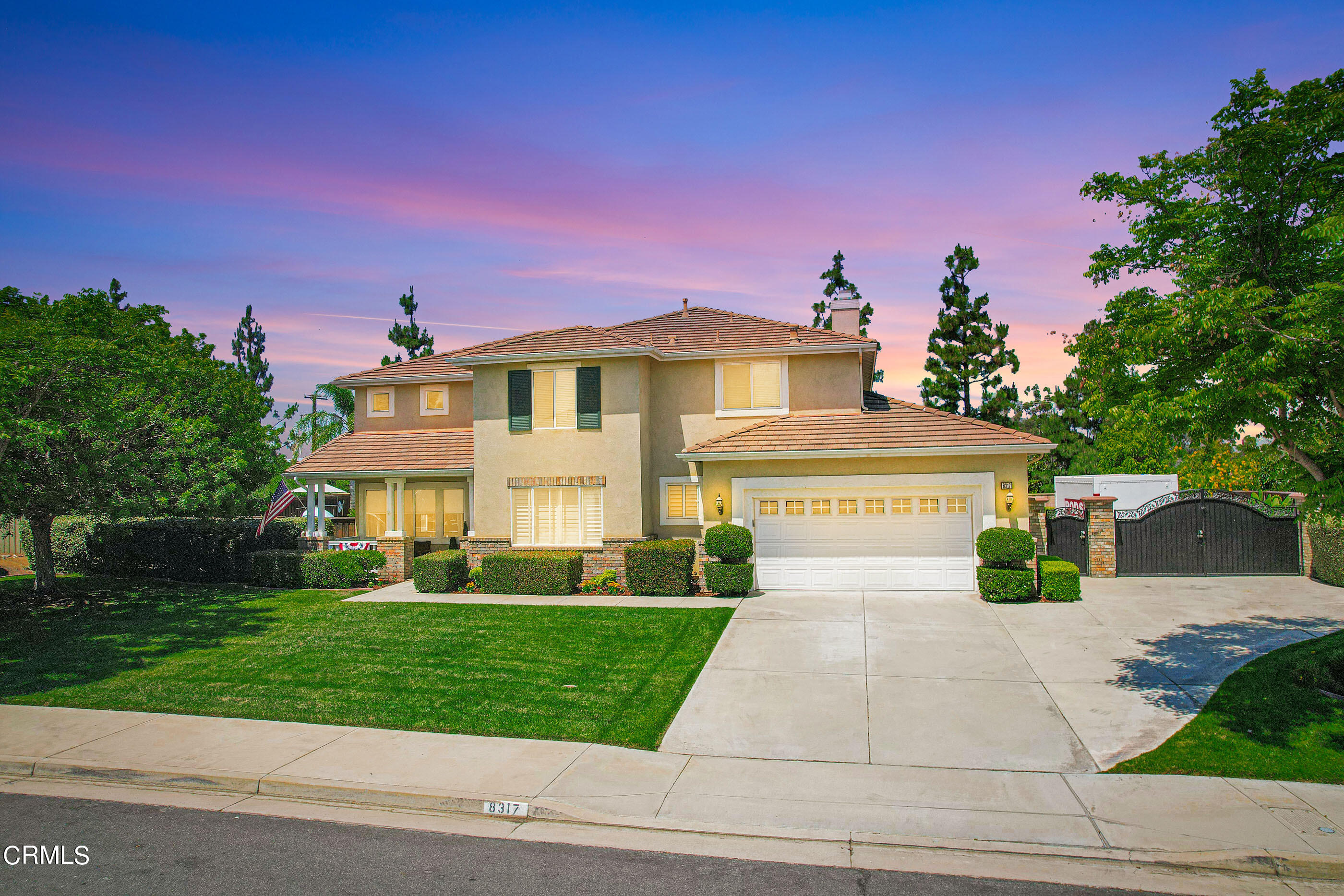 8317 Carriage Court Riverside, CA 92508 - Photo 5 of 37 a front view of a house with a yard
