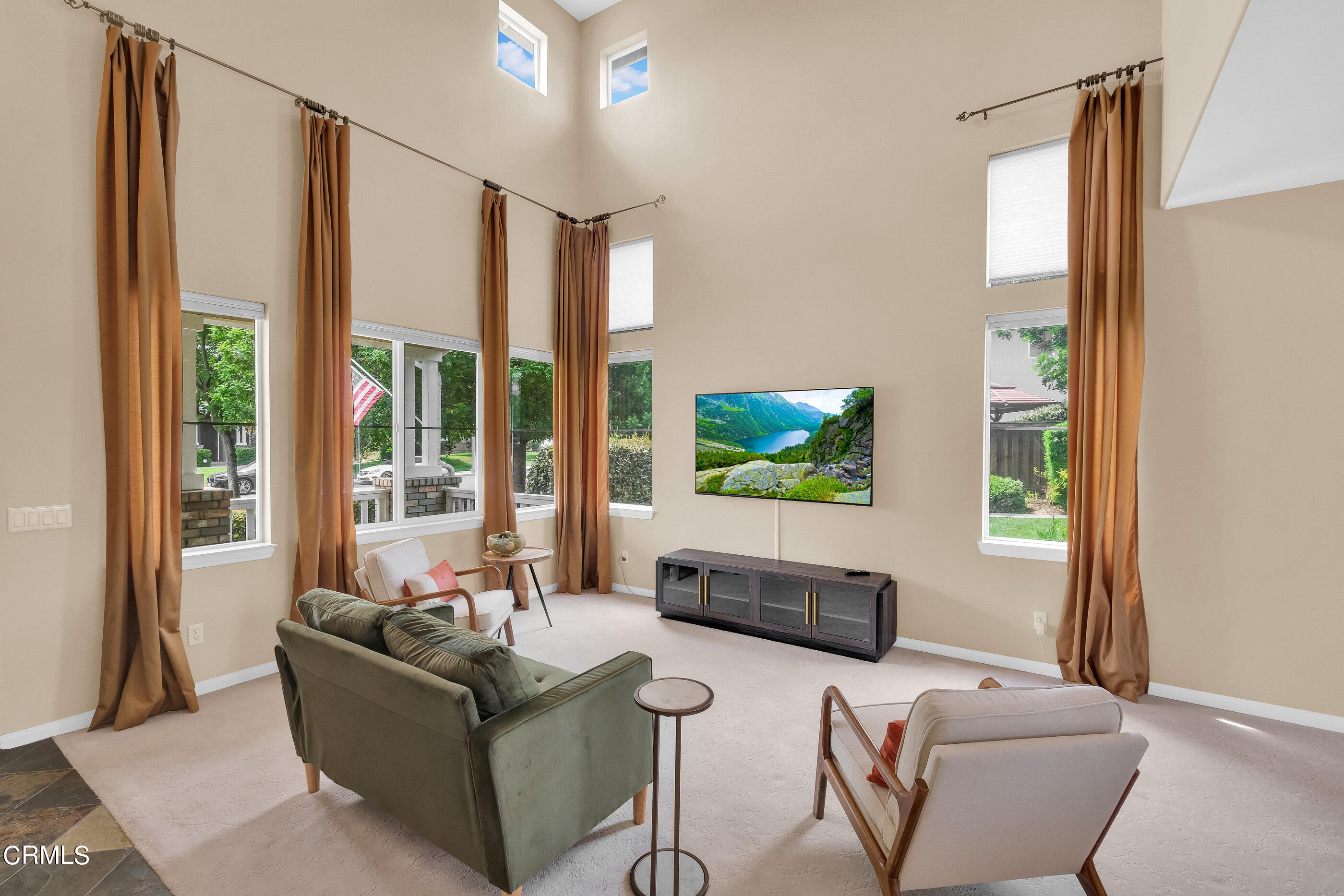8317 Carriage Court Riverside, CA 92508 - Photo 7 of 37 a living room with furniture and a flat screen tv