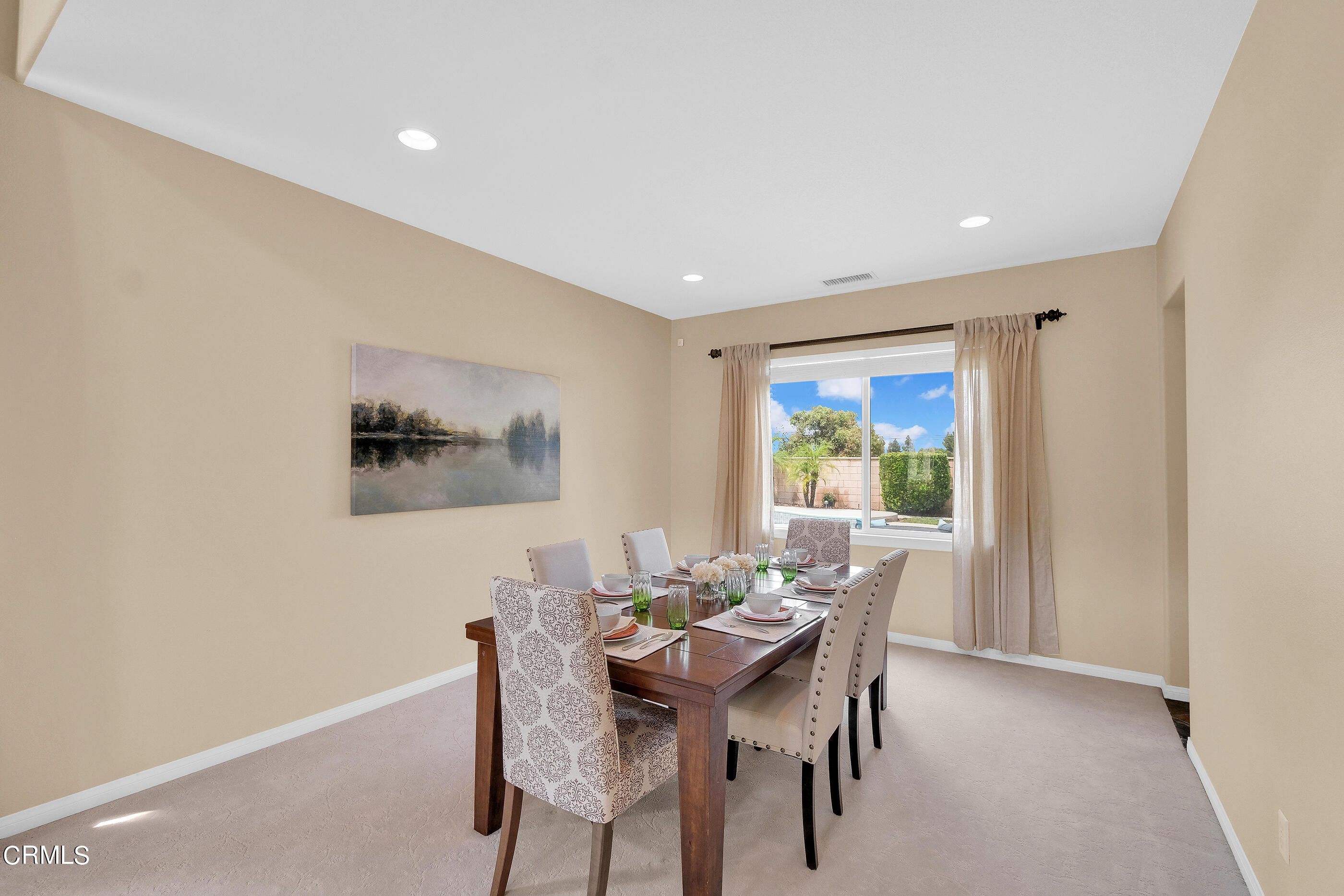 8317 Carriage Court Riverside, CA 92508 - Photo 9 of 37 a view of a dining room with furniture window and outside view