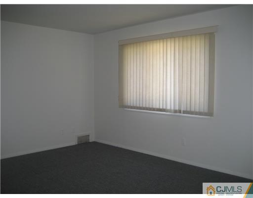 34 Idlewild Road Edison, NJ 08817 - Photo 1 of 7 an empty room with a window