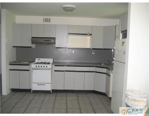 34 Idlewild Road Edison, NJ 08817 - Photo 3 of 7 a kitchen with cabinets and appliances