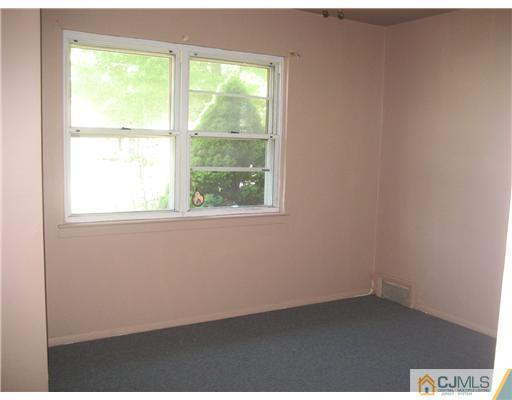 34 Idlewild Road Edison, NJ 08817 - Photo 7 of 7 an empty room with a window