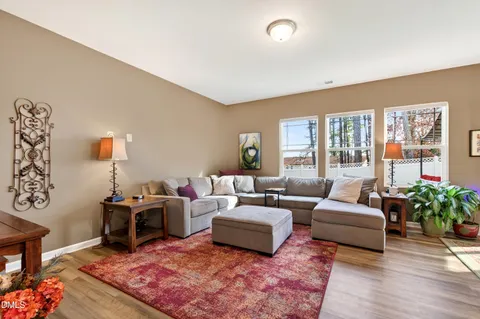 a living room with furniture or couch and a potted plant
