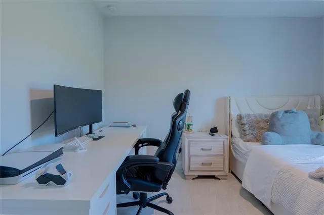 a bedroom with furniture and a bed