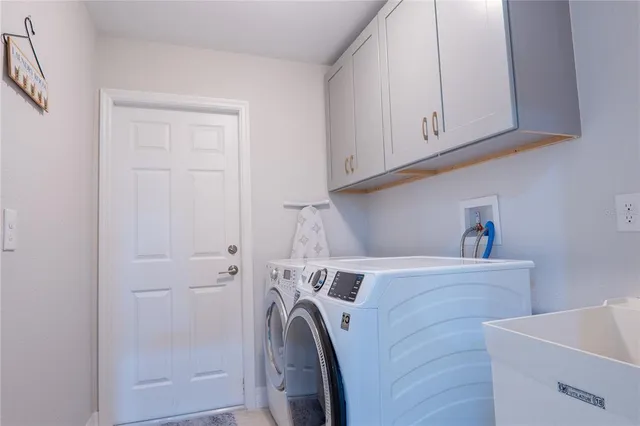 a utility room with dryer and washer