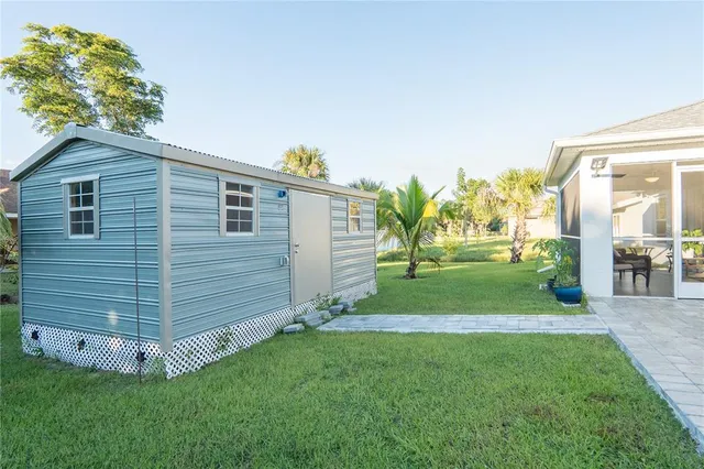 a view of a backyard with plants and a garden