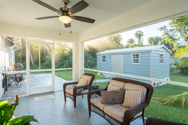 a balcony with furniture and garden view