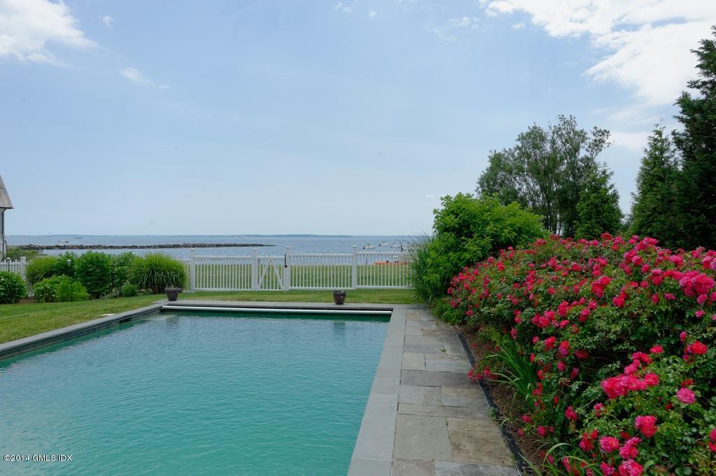 160 Shore Road Old Greenwich, CT 06870 - Photo 1 of 15 a view of a lake with a building in the background