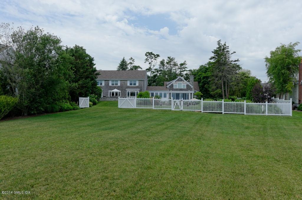 160 Shore Road Old Greenwich, CT 06870 - Photo 15 of 15 a view of a house with a big yard and a large trees