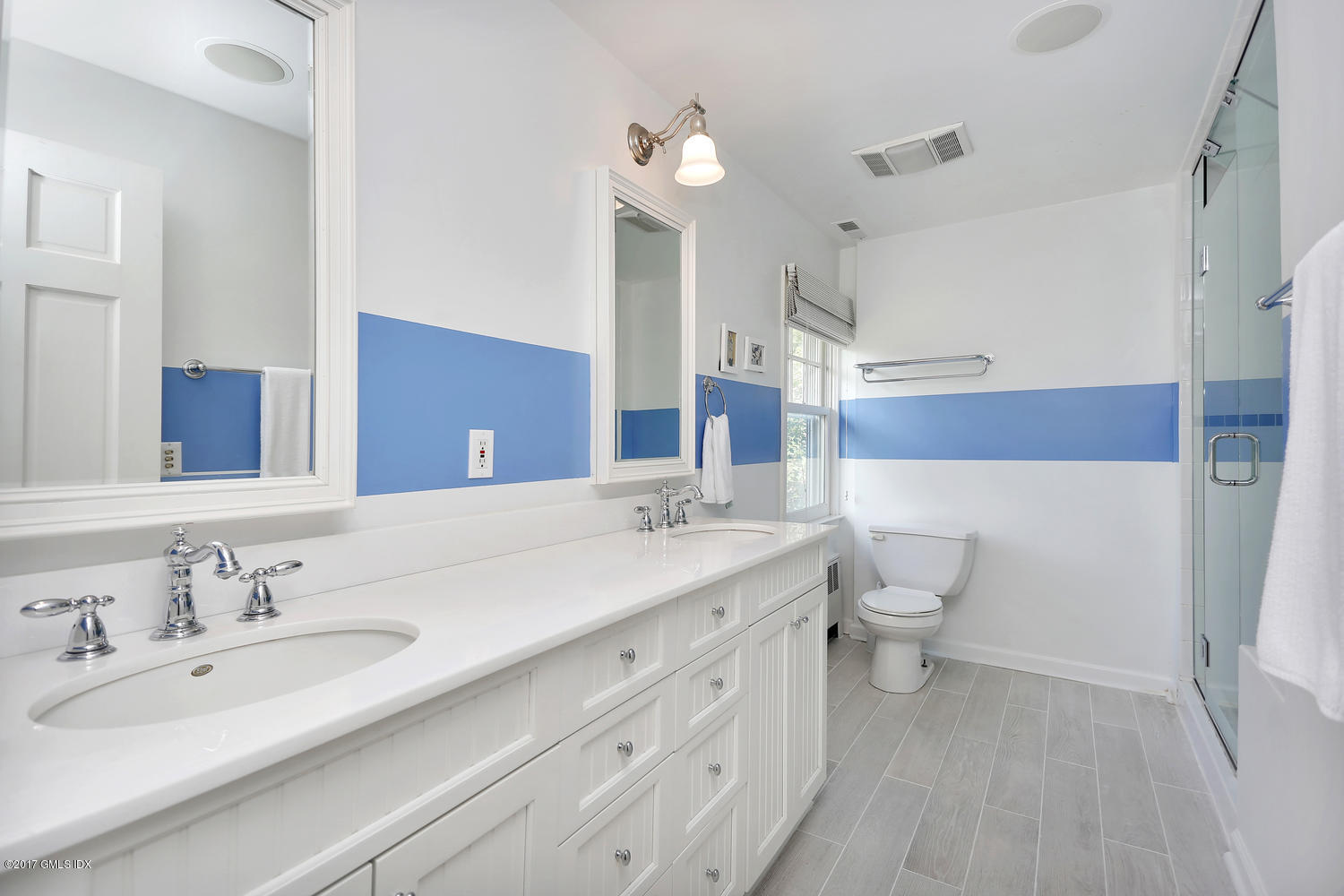 160 Shore Road Old Greenwich, CT 06870 - Photo 5 of 15 a bathroom with a sink a toilet and a mirror