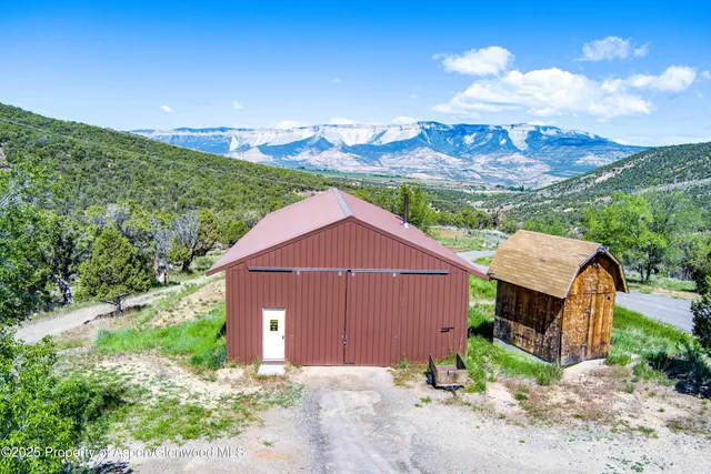 a view of backyard with large trees