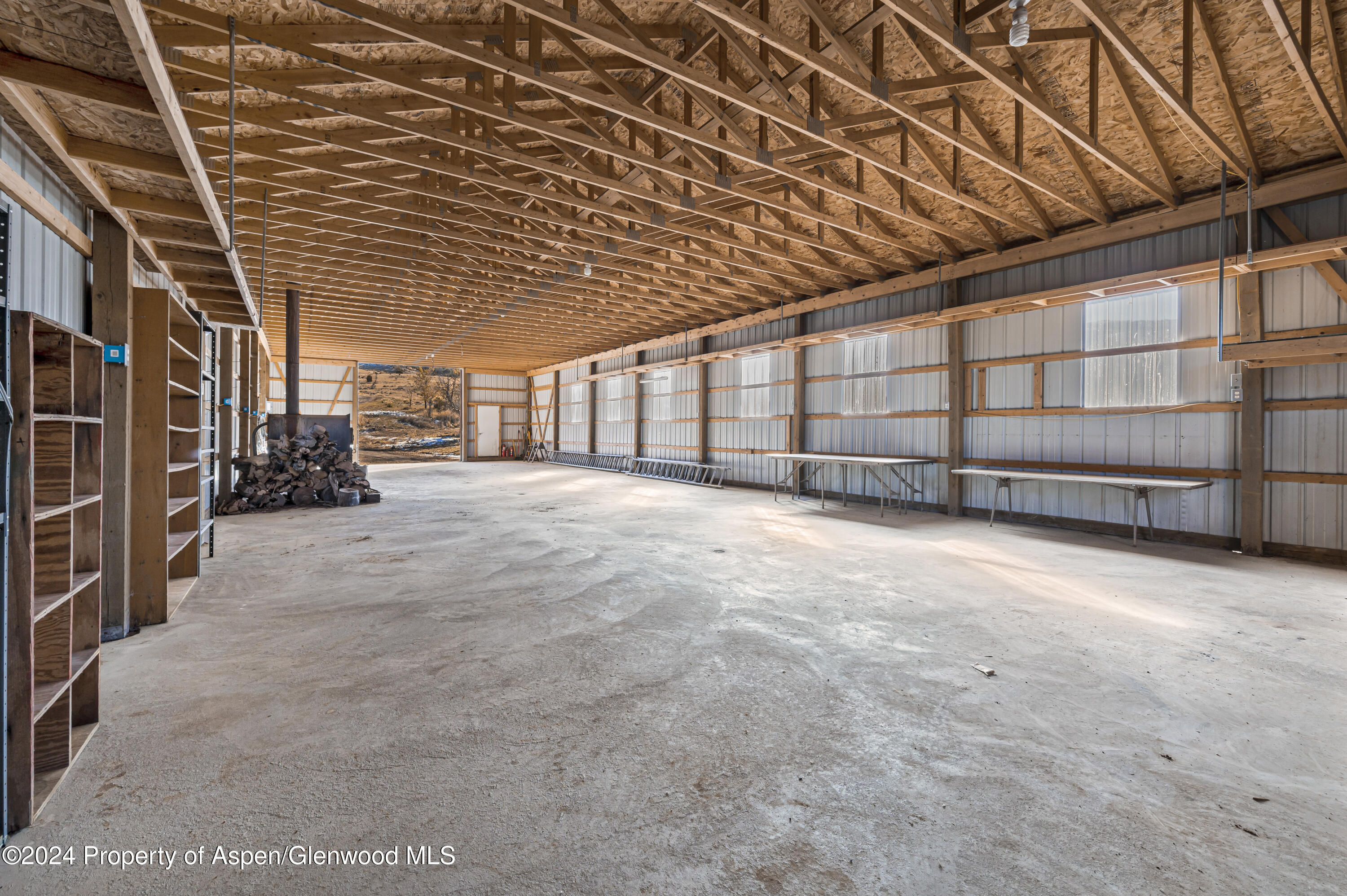 10444 County Road 320 Rifle, CO 81650 - Photo 5 of 48 a view of an empty room with wooden walls
