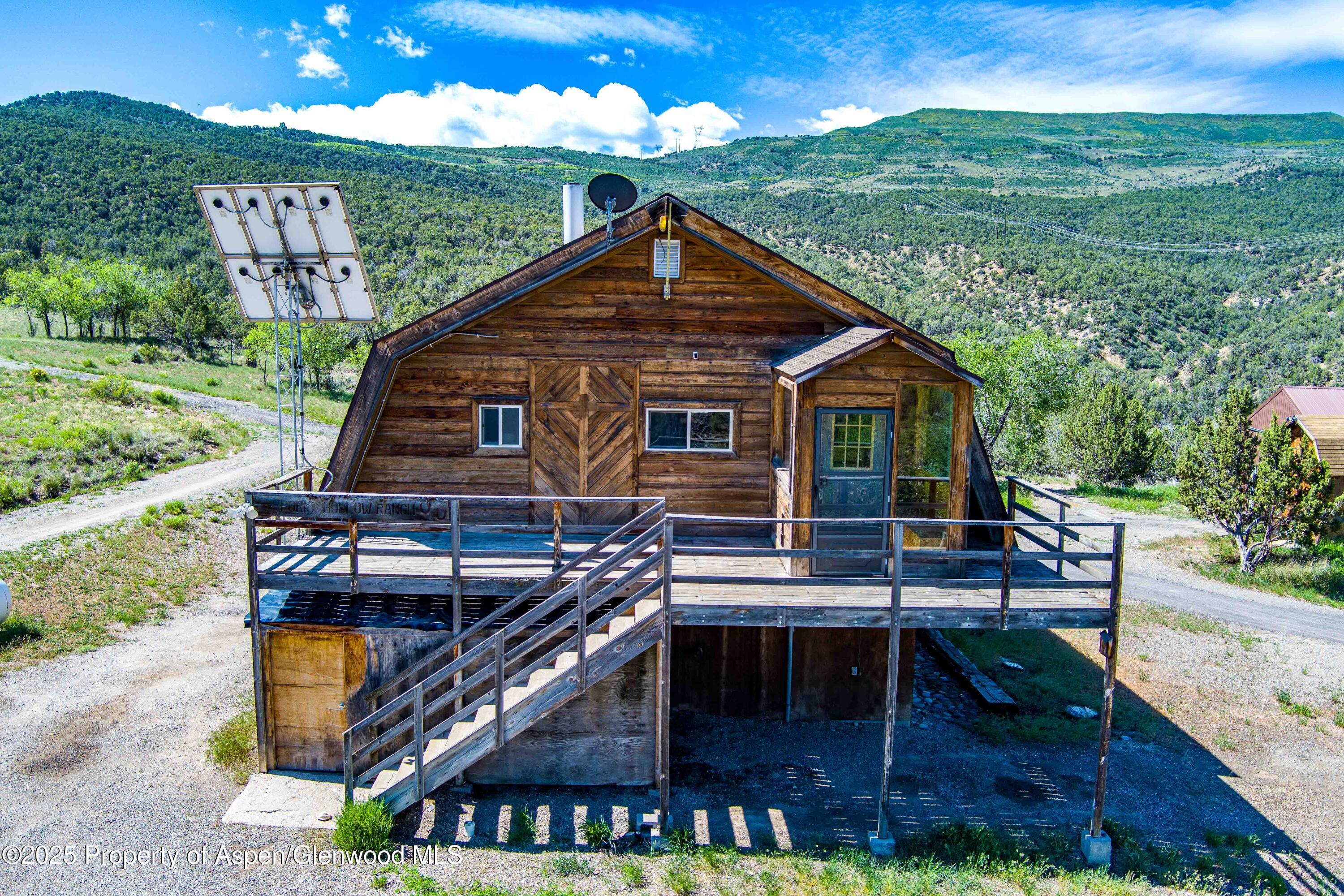 10444 County Road 320 Rifle, CO 81650 - Photo 7 of 48 a view of a house with a yard