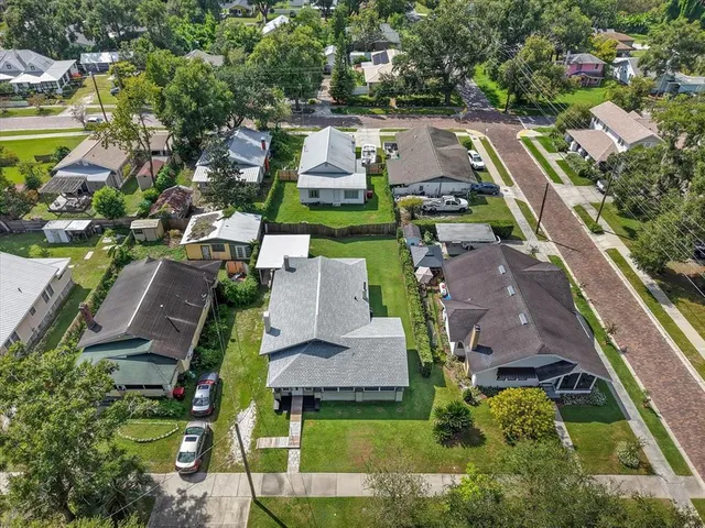 an aerial view of residential houses with outdoor space