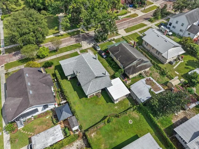 an aerial view of a house with a garden
