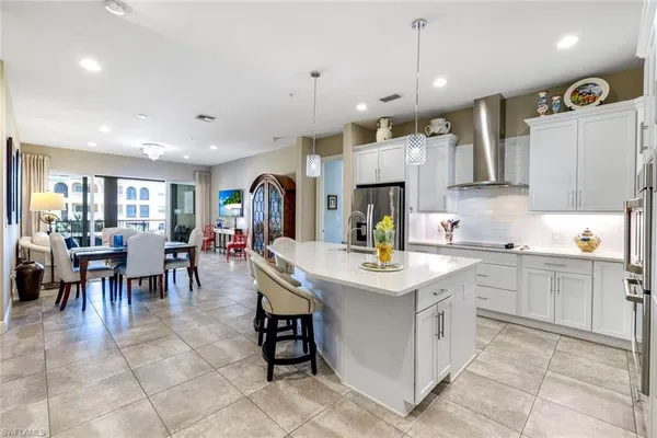 a living room with furniture a couch and a dining table
