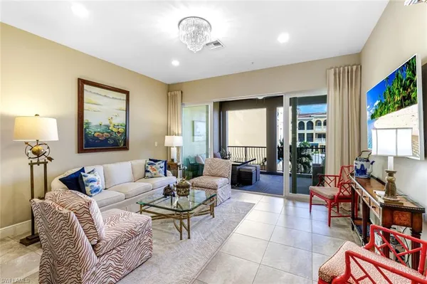 a large kitchen with kitchen island a sink counter space and living room view