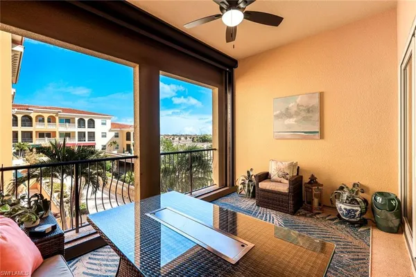 a kitchen with stainless steel appliances granite countertop a sink and a refrigerator