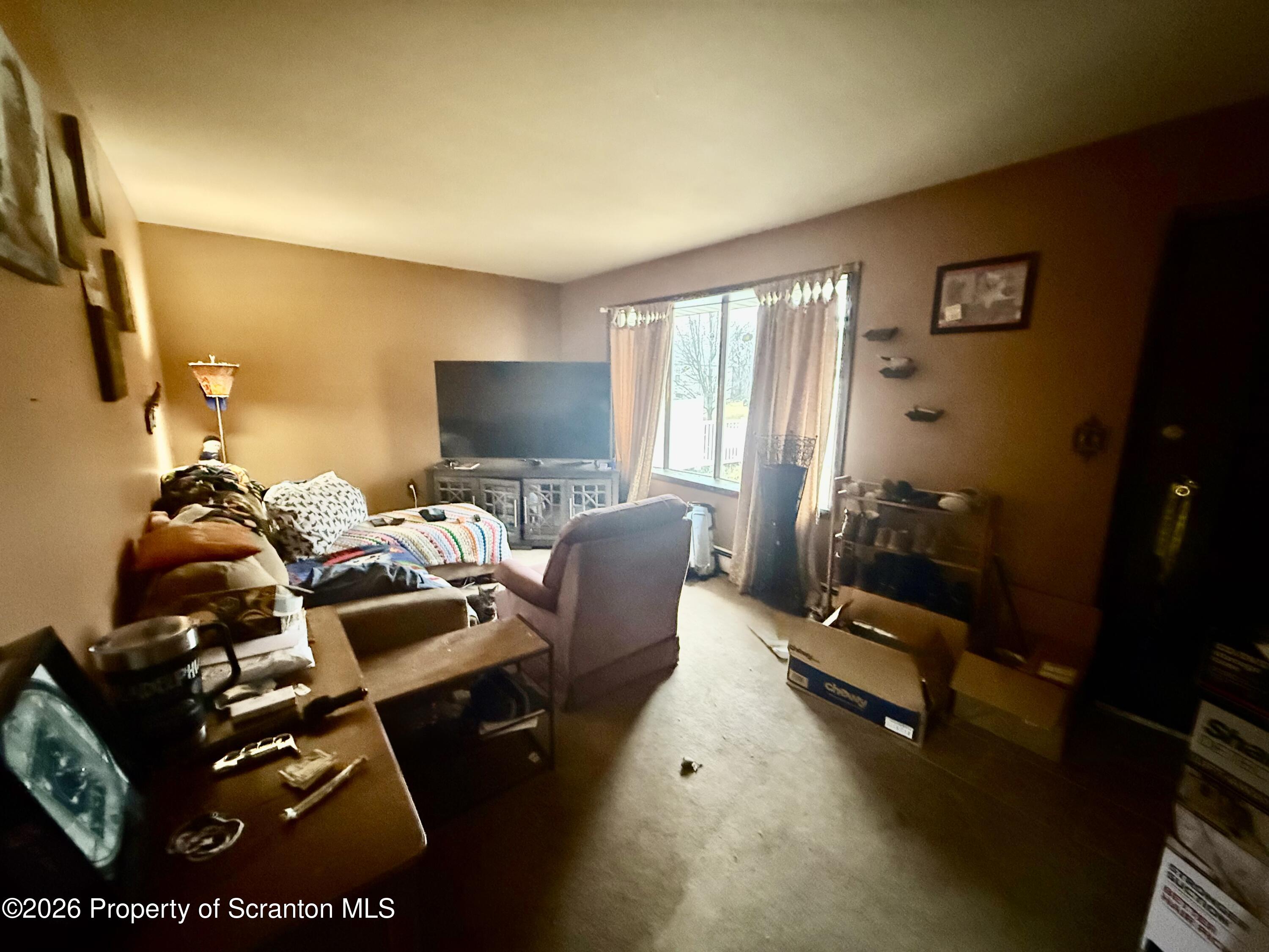2712 Lafayette Street Scranton, PA 18504 - Photo 15 of 18 a bedroom with furniture and a flat screen tv